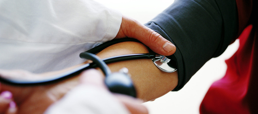 Doctor taking a patient's blood pressure