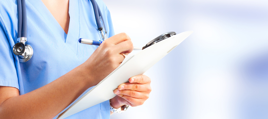 Doctor reviewing notes on clipboard