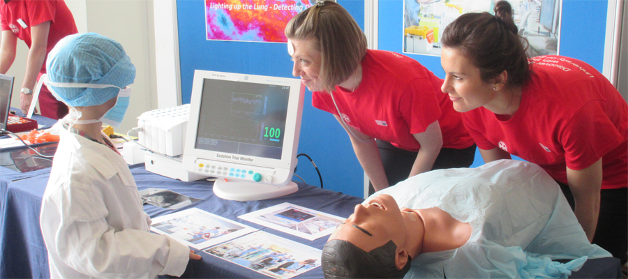 Research nurses talk to child