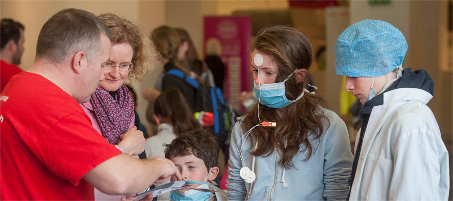 Researcher talks to parents and children