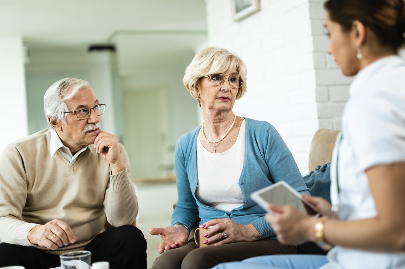 older couple talking to health professional