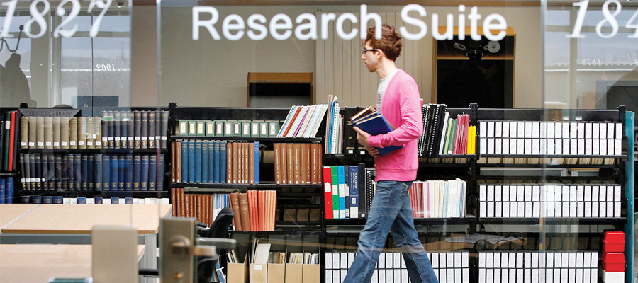 Male student in the Research Suite of the Main Library