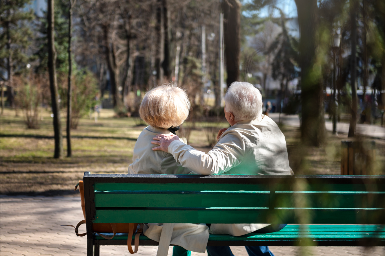 older people sitting on a bench